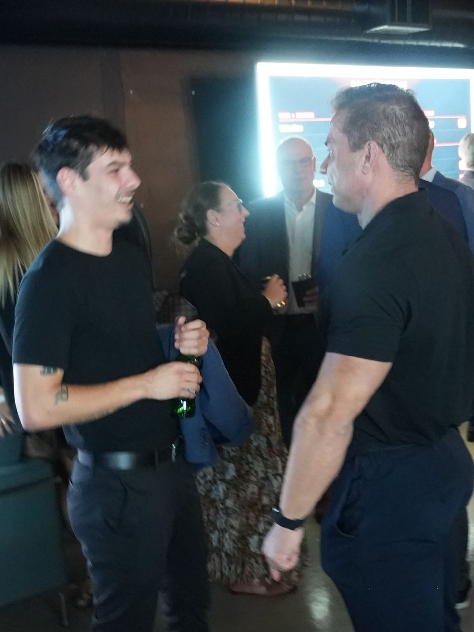 Guests talking over drinks on the main floor